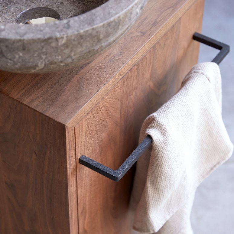 Stelle - Right-side solid walnut under-basin unit.