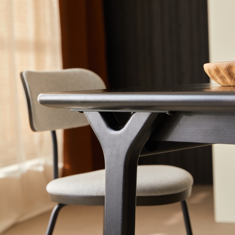 Clara - 6–12-seater extendable table in solid black oak